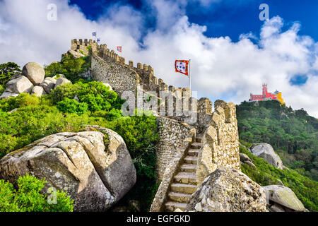 Sintra, Portugal at Castle of the Moors wall with Pena National Palace in the distance. Stock Photo