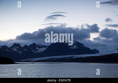 South Atlantic, South Georgia, layered clouds over mountains at dawn Stock Photo