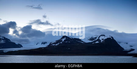 South Atlantic, South Georgia, layered clouds over mountains at dawn Stock Photo