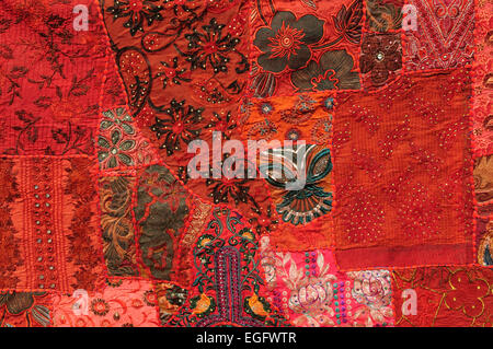 Close up of bright red wall hanging made up from old saris Madhya Pradesh India Stock Photo