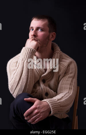 Portrait of handsome and young man in sweater Stock Photo
