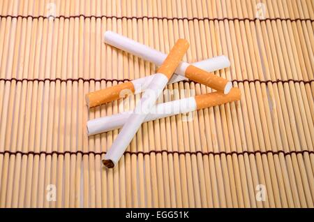 beautiful group of cigarettes set up on bamboo mat Stock Photo