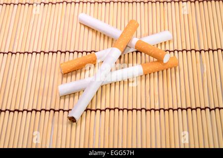 beautiful group of cigarettes set up on bamboo mat Stock Photo