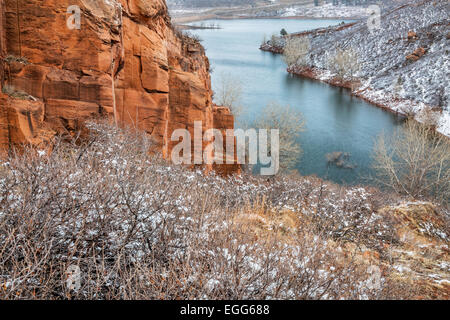 Old sandstone quarry on the shore of Horesetooth Reservoir near Fort Collins, Colorado, winter scenery with snow falling Stock Photo