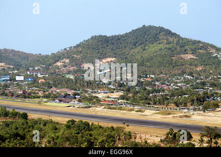 The plane takes off from the airport of Koh Samui in Thailand Stock Photo