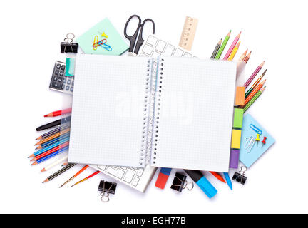 Blank notepad over school and office supplies on office table. Isolated on white background. Top view with copy space Stock Photo