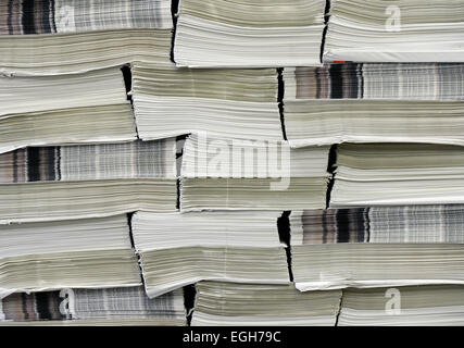 Potsdam, Germany. 24th Feb, 2015. Newspapers are stacked after printing in a printing press in Potsdam, Germany, 24 February 2015. The Federal Association of German Newspaper Publishers is presenting on 25 February 2015 a trend poll on the 'Newspaper Branch 2015.' Photo: Ralf Hirschberger/dpa/Alamy Live News Stock Photo