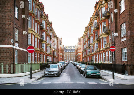 LONDON, UK - APRIL 15, 2014: Montagu Mansions is an established red brick mansion block which has porterage. Stock Photo