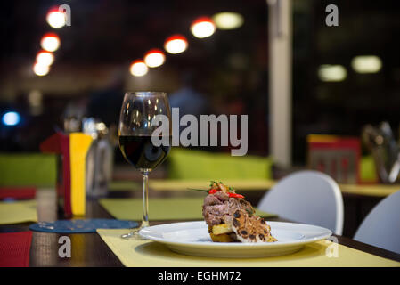 Flank steak with grilled potatoes, garlic and chilli pepper served in restaurant Stock Photo