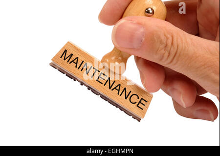 maintenance printed on rubber stamp Stock Photo