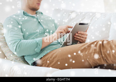 close up of man with tablet pc computer at home Stock Photo