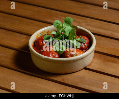 Albondigas. Spanish pork and beef meatballs served in marinara sauce. Stock Photo