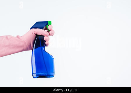 human hand with protective glove holding cleaning spray bottle. isolated on white Stock Photo