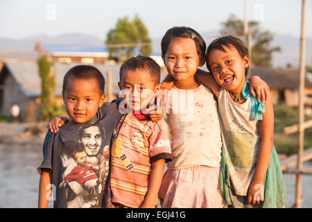Children,some with thanaka,cosmetic paste on face at village on bank of Inle Lake,Burma,Myanmar, Stock Photo