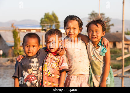 Children,some with thanaka,cosmetic paste on face at village on bank of Inle Lake,Burma,Myanmar, Stock Photo
