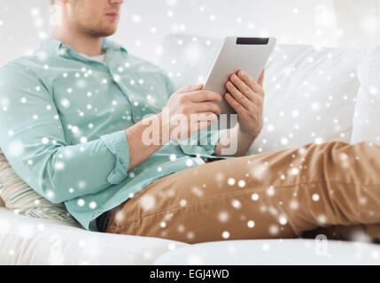 close up of man with tablet pc computer at home Stock Photo