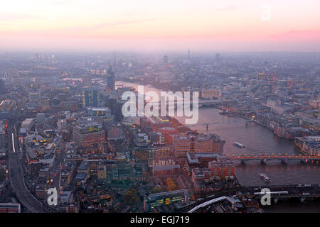 London rooftop view panorama at sunset with urban architectures with Thames River at night Stock Photo