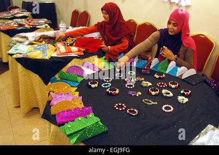 Visitors take keen interest at a stall during Exhibition for Encouragement of IDPs Women arranged by Youth Resource Centre held at local hotel in Peshawar on Wednesday, February 25, 2015. Stock Photo