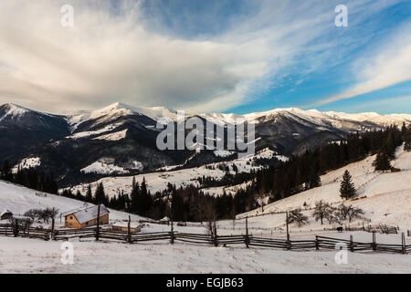 Beautiful snow-capped mountains against the blue sky. Stock Photo