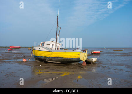 Inshore fishing boats in Morecambe Bay, aground and waiting for the next tide Stock Photo