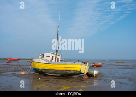 Inshore fishing boats in Morecambe Bay, aground and waiting for the next tide Stock Photo