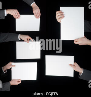 collection of hand holding blank paper on black Stock Photo