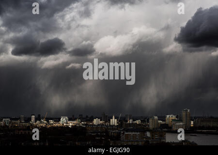Dark storm clouds, heavy rain with sun break moves across central London Stock Photo