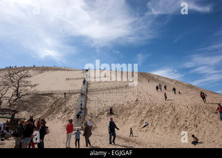 Tourist climbing the The Dune of Pilat, the tallest sand dune in Europe Stock Photo