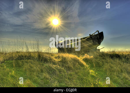 hdr image of an abandoned boat dungeness beach kent Stock Photo