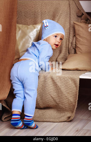 Little cute baby in pajamas, shot in home interior Stock Photo