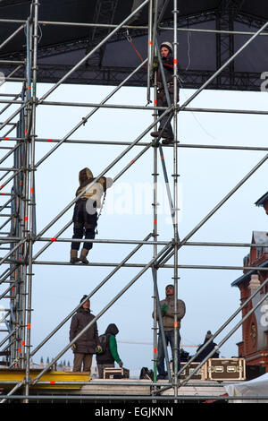 Moscow , Russia - February 21 , 2015:  Construction workers working on scaffolding . Mount Billboard next to Red Square. Russia, Stock Photo