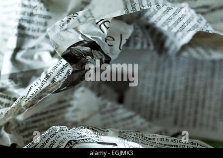 Focus on a French torn and crumpled newspaper Stock Photo
