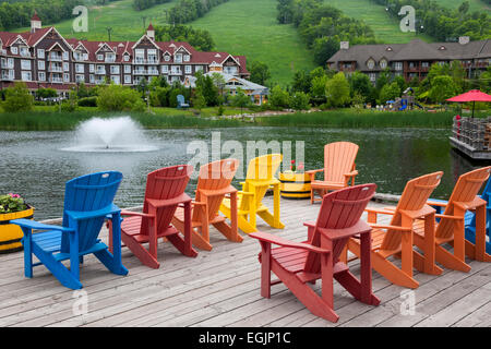 COLLINGWOOD, ON, CANADA - JUNE 18: Colorful deck chairs on Mill pond dock in summer at Blue Mountain Village, 2014 Stock Photo