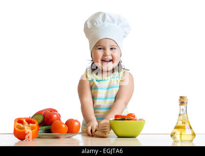 cook kid girl preparing vegetables Stock Photo