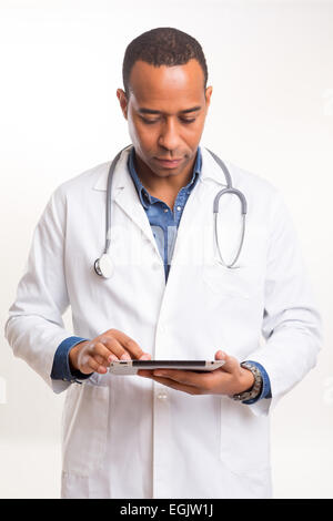 Handsome young african doctor posing isolated over a white background Stock Photo