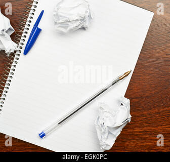 Lined note book over the table Stock Photo