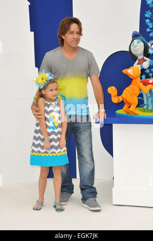 LOS ANGELES, CA - JULY 28, 2013: Larry Birkhead & Dannielynn Marshall (daughter of the late Anna Nicole Smith) at the Los Angeles premiere of 'The Smurfs 2' at the Regency Village Theatre, Westwood. Stock Photo