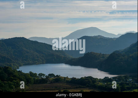 Llyn Gwynant lake with the hills above Beddgelert behind. Taken from the A498 Plas Gwynant Stock Photo