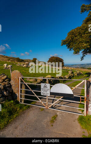 Gate on a gated country lane in the Conwy valley, North Wales, near the village of Rowen Stock Photo