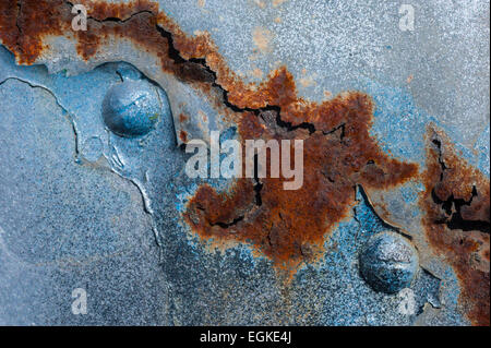 rusting and decaying metal on an old warehouse door Stock Photo