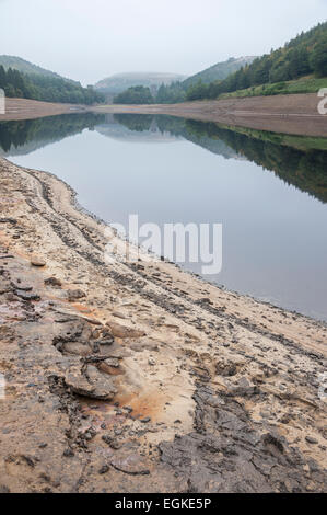 Low water levels at Derwent reservoir on a calm September morning. View looking toward Howden dam. Stock Photo
