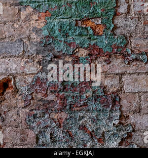 Paint peeling from an old wall Stock Photo