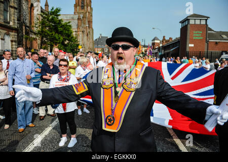 Belfast, Northern Ireland. 12th July 2013 - County Grand Marshal for Belfast District Orange Order calls for the road to be cleared as the parade is permitted to proceed. Stock Photo
