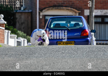 25th August 2013, Belfast - A Forensics Officer photographs a suspect device during a security alert in East Belfast Stock Photo