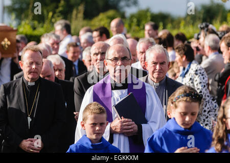 Bellaghy, Northern Ireland. 2nd September 2013 - Father Andrew Dolan leads a funeral cortege Stock Photo