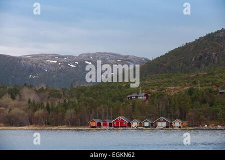 Traditional Norwegian small fishing village with colorful wooden houses on seacoast Stock Photo