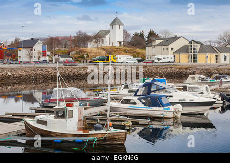 Norwegian fishing village landscape. Small boats are moored in marina Stock Photo