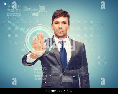 attractive buisnessman working with virtual screen Stock Photo