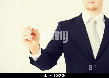 man writing something in the air Stock Photo