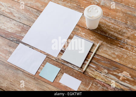 close up of notebook, coffee cup and papers Stock Photo